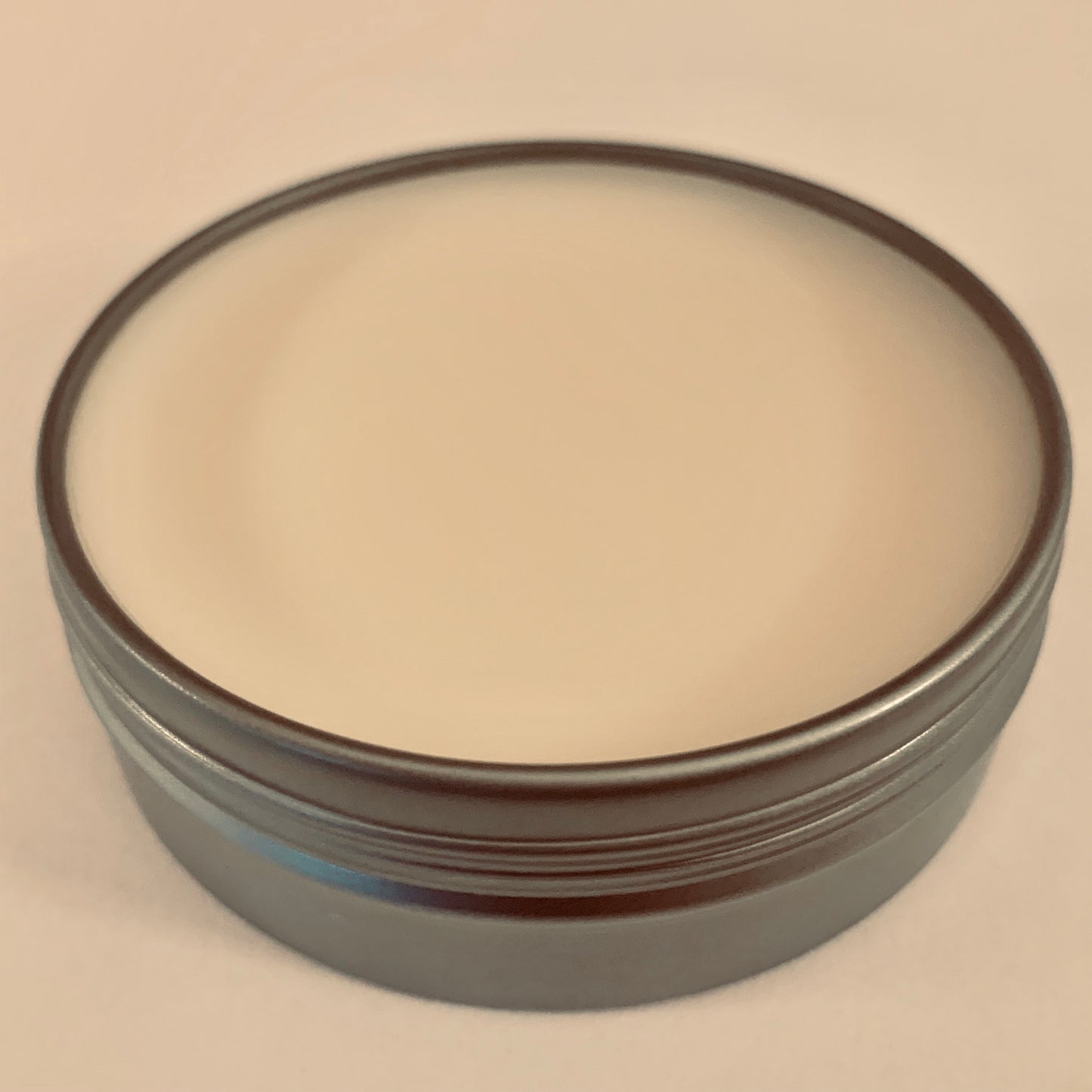 Cover removed from Ferocious Beard Wax tin.