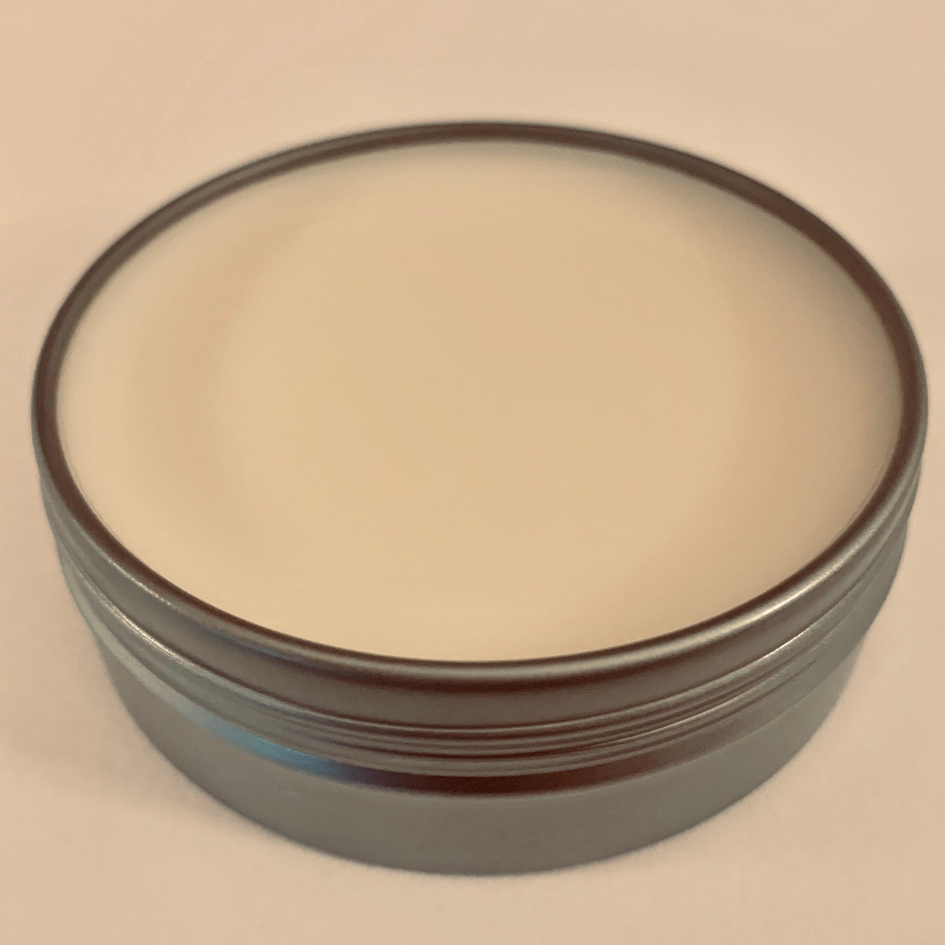 Cover removed from Ferocious Beard Wax tin.